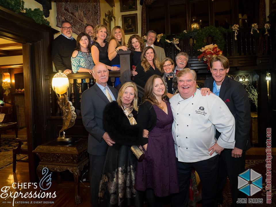 Guests pose for a picture at our wine dinner at the Gramercy Mansion