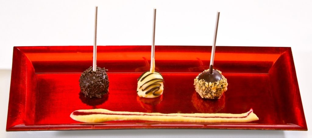 Local catering picture of cheesecake lollipops.